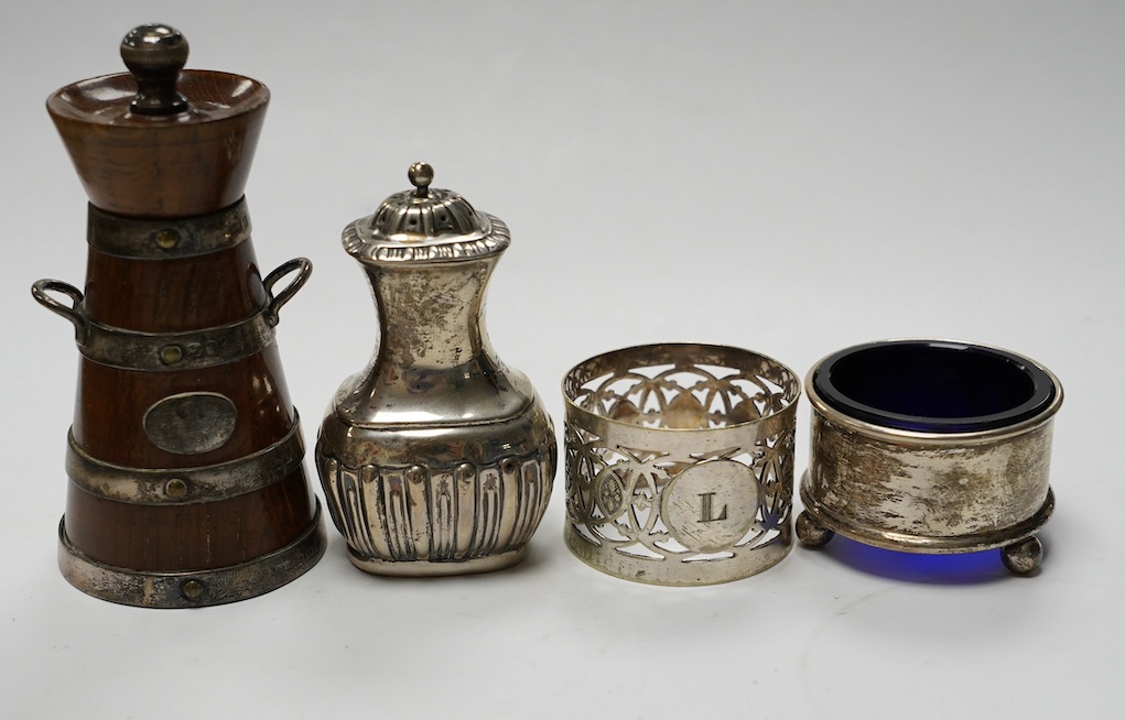 Small silver to include a cased Victorian silver Queens pattern christening trio, London 1837, four various silver napkin rings, a plated napkin ring, two condiments and a silver mounted wooden 'milk churn' pepper mill.